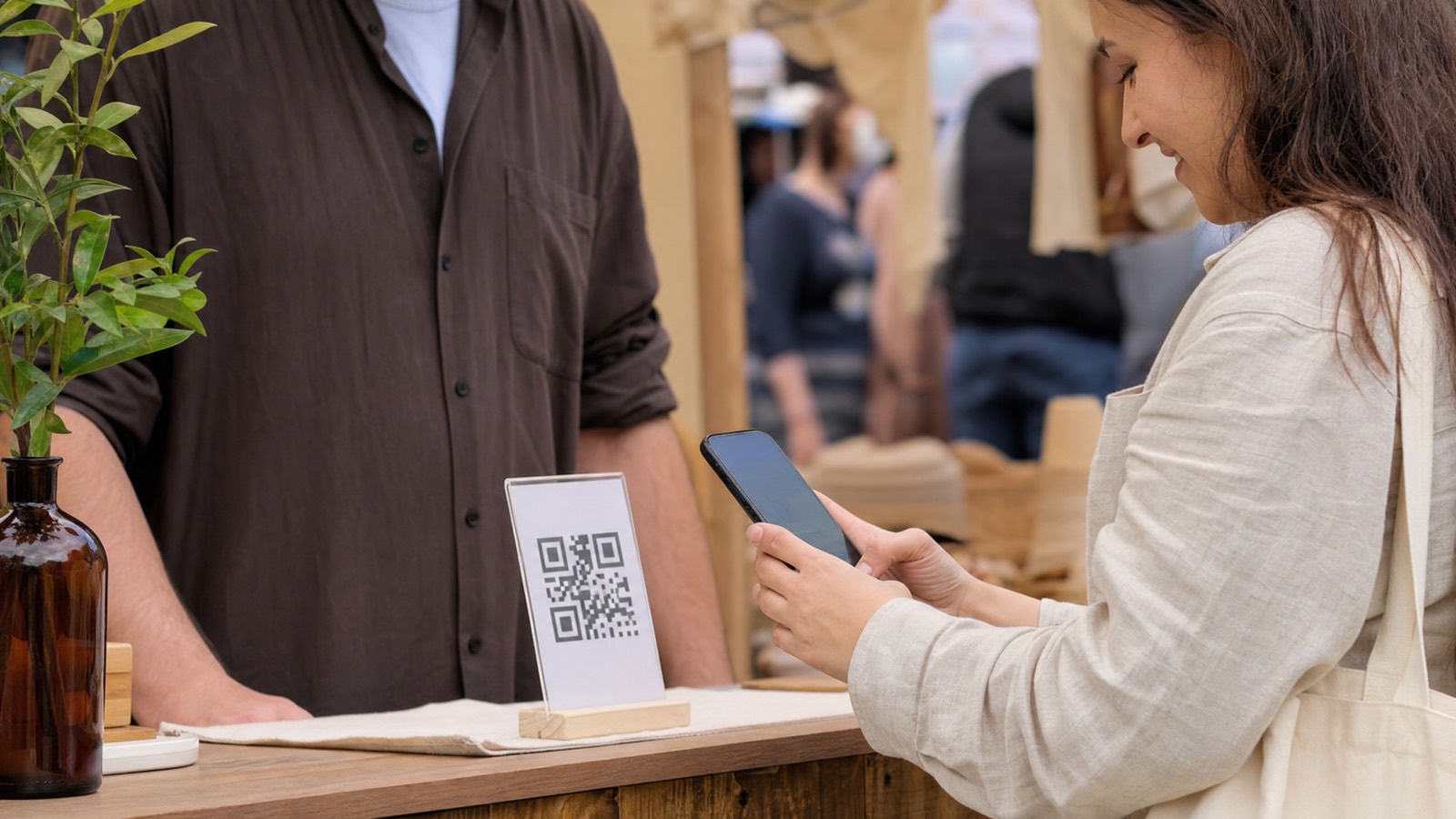 Customer paying via a hosted checkout link and QR code